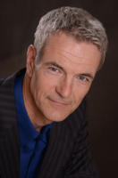 Douglas Talbot Smiling older man with short gray hair and blue eyes